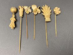 SIX VARIOUS LATE 19TH CENTURY CARVED BONE AND BASE METAL STICK PINS&nbsp;