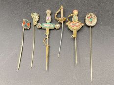 SIX VARIOUS WHITE AND BASE METAL STICK PINS