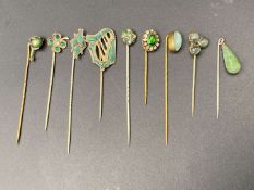 NINE VARIOUS SILVER AND BASE METAL STICK PINS