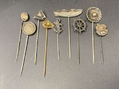 NINE VARIOUS SILVER AND BASE METAL STICK PINS