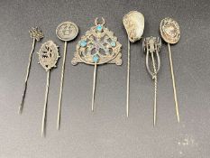 SEVEN VARIOUS SILVER AND BASE METAL STICK PINS&nbsp;