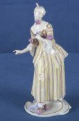 „Lucinda“ aus der Commedia dell'Arte. Nymphenburg 20. Jh. Porzellan, aufwendig bemalt und gold gesä
