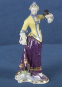 „Colombine“ aus der Commedia dell'Arte. Nymphenburg 20. Jh. Porzellan, aufwendig bemalt und gold ge