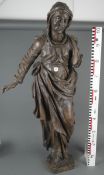 Stehende Heilige. Wohl Deutsch 19. Jh. Massivholz, geschnitzt, mit Resten alter Fassung, H=113 cm.