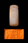 GREEK PERIOD WHITISH STONE CYLINDER SEAL WITH GUARDIAN FIGURES AND A WINGED BUST