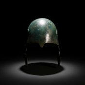 RARE EARLY CHALCIDIAN BRONZE HELMET WITH DECORATED CHEEKPIECES