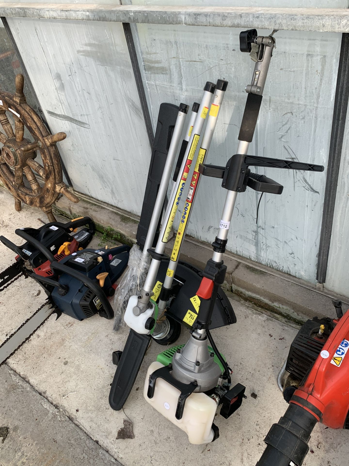 A FLORABEST PETROL MULTI TOOL WITH GRASS STRIMMER, CHAINSAW AND HEDGE TRIMMER ATTATCHMENTS - Image 3 of 3