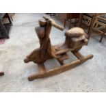 A HARDWOOD ROCKING CHAIR IN THE FORM OF A SCOOTER