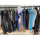 A RAIL OF ASSORTED BRANDED SPORTS AND DESIGNER CLOTHES