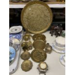 A COLLECTION OF BRASSWARE TO INCLUDE, A LARGE ASIAN CHARGER, PLATES, FIGURES, BOWLS, ETC