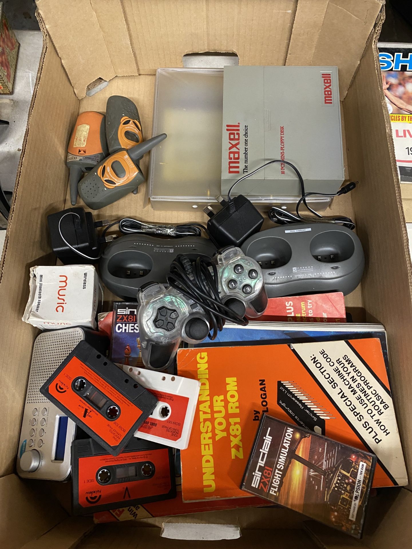 A QUANTITY OF SINCLAIR GAMES, BOOKS, A RADIO, ETC