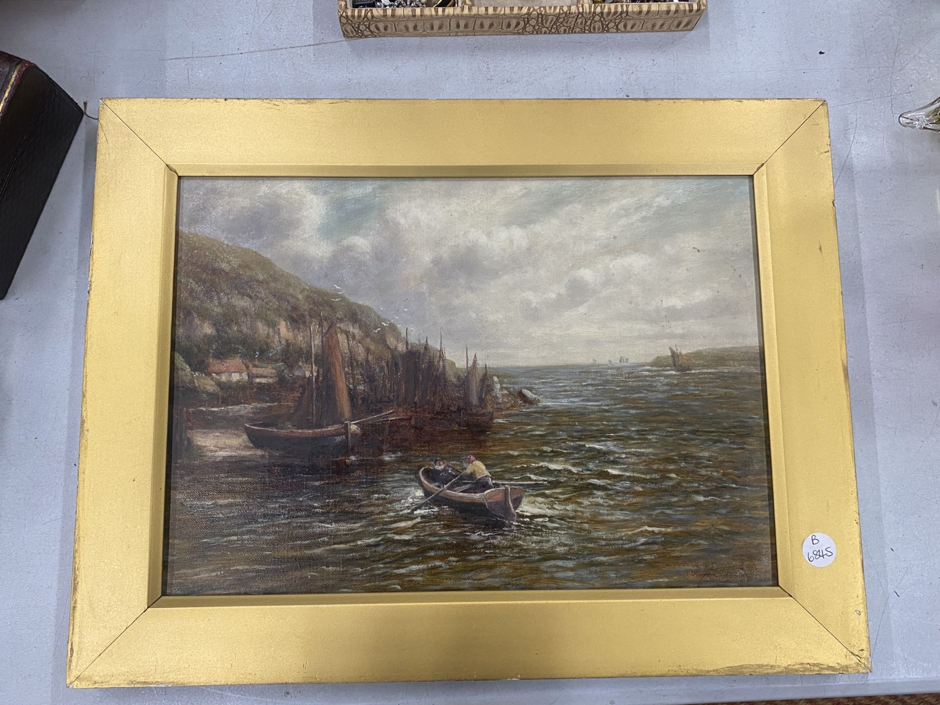 A SMALL GILT FRAMED OIL ON CANVAS PAINTING TITLED 'FISH IN HARBOUR - CORNWALL' SIGNED
