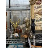 AN ASSORTMENT OF VARIOUS WOODEN, RESIN AND METAL ANIMAL FIGURES