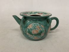 A CHINESE ENAMELLED YIXING TEAPOT WITH A GREEN GLAZED BODY AND ENAMELLED FLORAL DECORATION