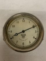 A VINTAGE 1930'S SMITH'S CAR DASHBOARD CLOCK, WITH A WHITE DIAL AND BLUE HANDS, MADE BY THE