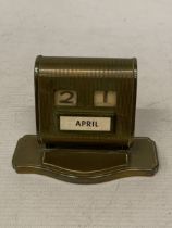 A 1930'S BRASS PERPETUAL DESK CALENDAR