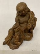 A CHINESE BAMBOO CARVING OF THE DAOIST IMMORTAL LIO HAI, WITH A THREE LEGGED WEALTH TOAD AND CASH
