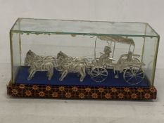 A SILVER WIRE MODEL OF A CARRIAGE AND HORSES IN A GLASS CASE