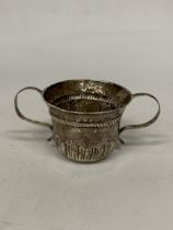 A SILVER TWIN HANDLED CUP WITH REPOUSSE DECORATION - WEIGHT 59.34 G