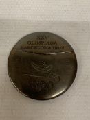 A COMMEMORATIVE MEDAL FROM BARCELONA OLYMPICS 1992, DESIGNED BY SPANISH ARTIST XAVIER CORBERO