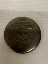 A COMMEMORATIVE MEDAL FROM BARCELONA OLYMPICS 1992, DESIGNED BY SPANISH ARTIST XAVIER CORBERO