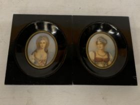 TWO MINIATURE HAND PAINTED CEARAMIC PORTRAITS IN WOODEN FRAMES