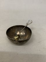 A BELIEVED TO BE SILVER ASIAN BOWL PLUS A HALLMARKED BIRMINGHAM SILVER WALKER AND HALL SPOON,
