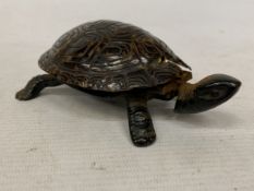 A VINTAGE NOVELTY TABLE BELL IN THE SHAPE OF A TORTOISE WITH A CAST BRONZE BASE - A/F
