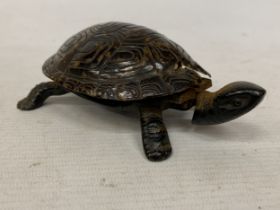 A VINTAGE NOVELTY TABLE BELL IN THE SHAPE OF A TORTOISE WITH A CAST BRONZE BASE - A/F