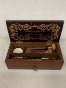A VINTAGE OAK WINSOR AND NEWTON, LONDON PEN BOX WITH LOWER DRAWER CONTAINING A QUANTITY OF ITEMS