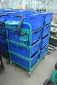 AN ALUMINIMUM WORK TROLLEY WITH 8 BASKETS NO VAT