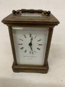 A MATTHEW NORMAN LONDON CARRIAGE CLOCK WITH SWISS MOVEMENT HOUSED IN A BRASS CASE
