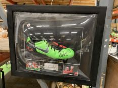 A SIGNED FOOTBALL BOOT FROM WAYNE ROONEY IN A CONVERSE CASE