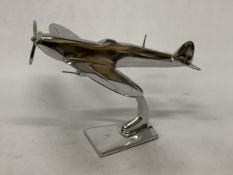 A LARGE CHROME SPITFIRE ON STAND