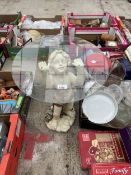 A GLASS TOPPED SIDE TABLE WITH CHERUB BASE