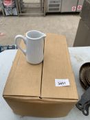 A BOX OF TWELVE WHITE JUGS