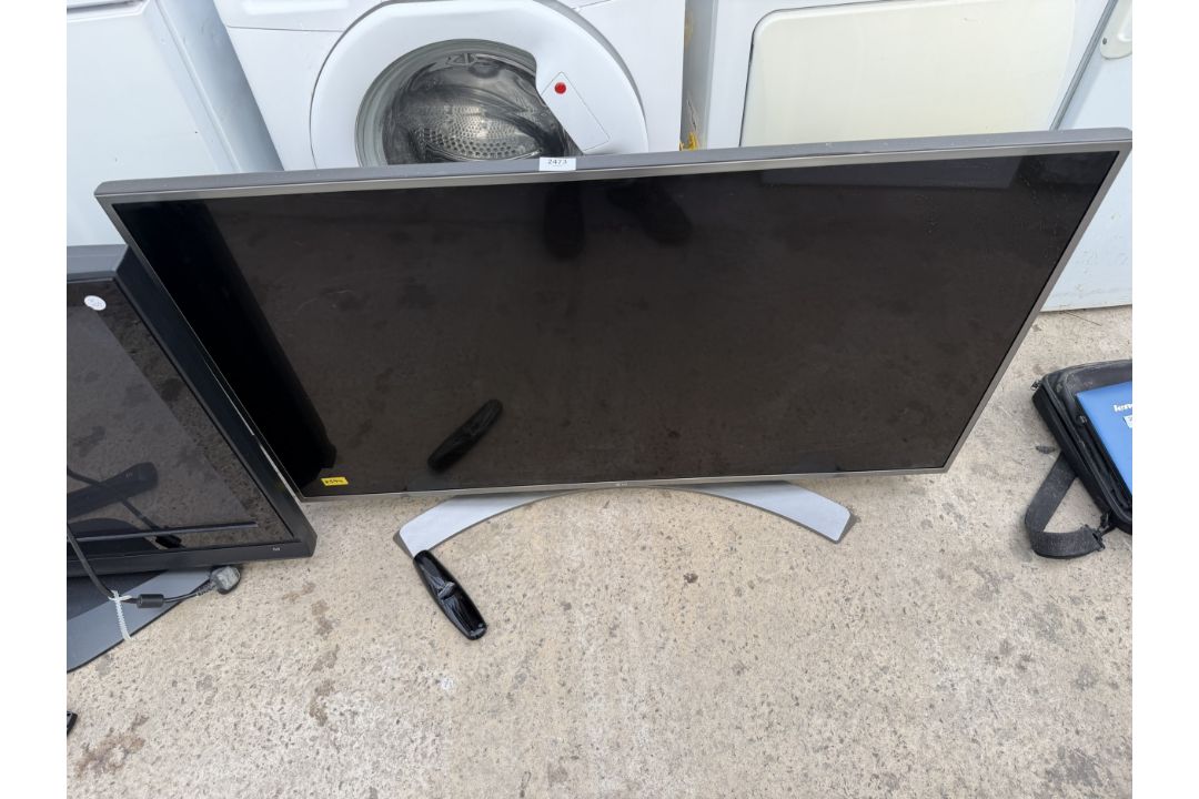 AN LG 49" TELEVISION WITH REMOTE CONTROL - Image 1 of 3
