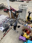 AN OPTI FOLDING EXERCISE BIKE, A SNOOKER CUE AND WILSON LEFT HANDED GOLF IRONS