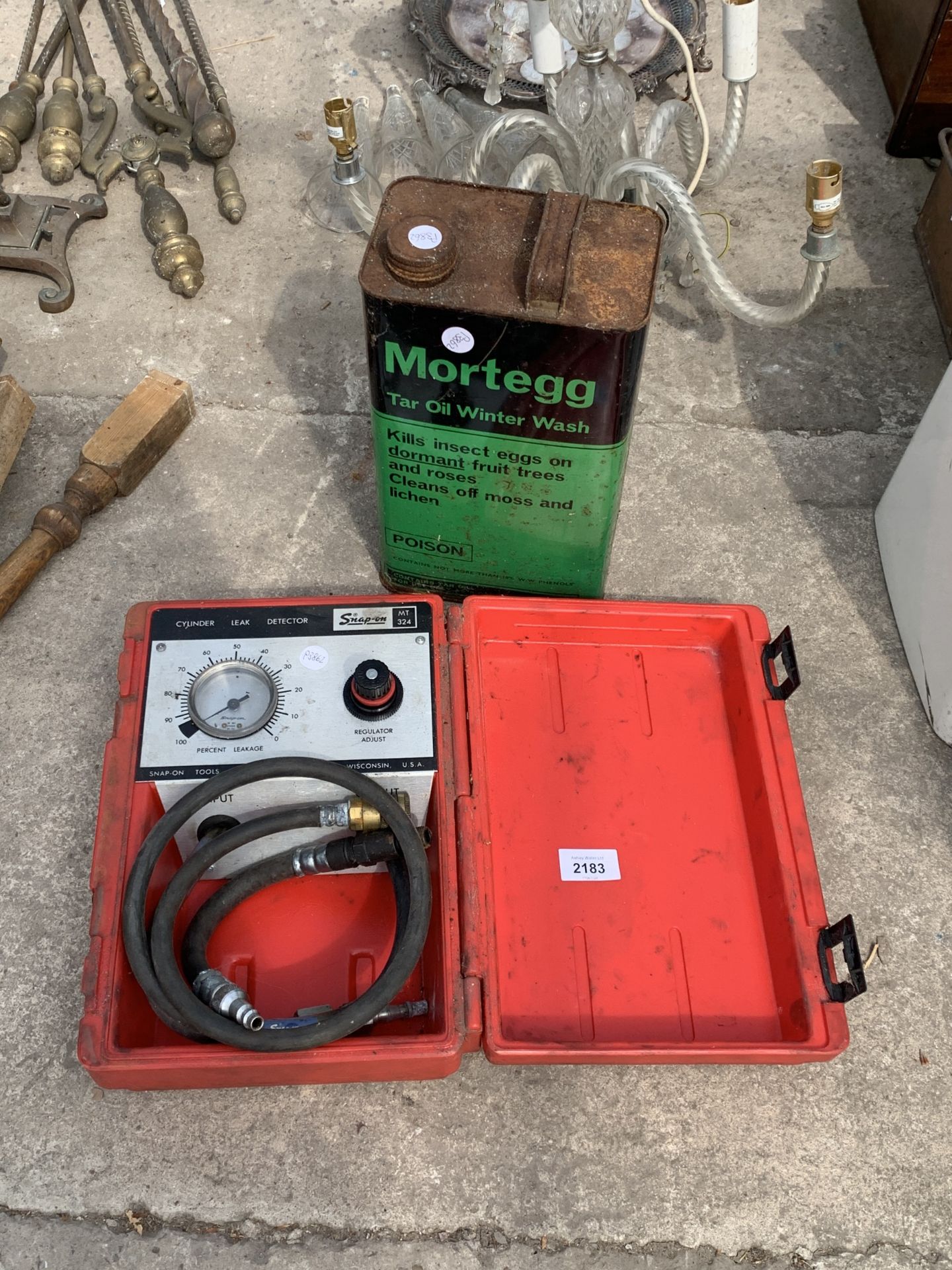 A CYLINDER LEAK DETECTOR AND A VINTAGE OIL CAN