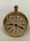 AN EXCALIBUR QUARTZ CLOCK IN A POLISHED GOLD-PLATED CASE