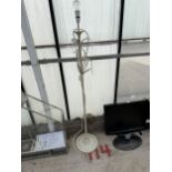 A DECORATIVE METAL STANDARD LAMP