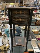 A SMALL BLACK AND GOLD TWO DRAWER SIDE TABLE, HEIGHT 66CM