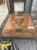 A VINTAGE FOILDER WITH DECORATIVE COPPER FRONT COVER