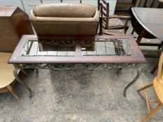 A HARDWOOD SIDE TABLE WITH INSET GLASS TOP ON SHAPED METALWARE LEGS AND FRIEZE, 52" WIDE