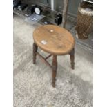 A VINTAGE PINE FOUR LEGGED STOOL