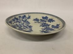 A JAPANESE MEIJI PERIOD BLUE AND WHITE PORCELAIN CHARGER DEPICTING FISH IN A RIVER LANDSCAPE,