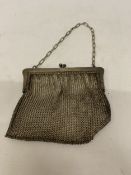 A VICTORIAN SILVER PLATED MESH COIN PURSE