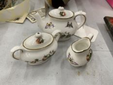 A COALPORT 'STRAWBERRY' MINIATURE TEAPOT, SUGAR BOWL AND MILK JUG
