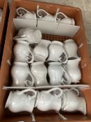 FIFTEEN WHITE JUGS IN CRATE