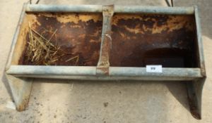 A GALVANISED IRON FEED TROUGH, 24" LONG + VAT